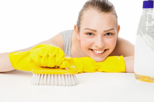 Cleaner working in a Kingston apartment during a deep clean visit