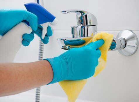 Cleaning specialist removing stains from fabric seating in Kingston